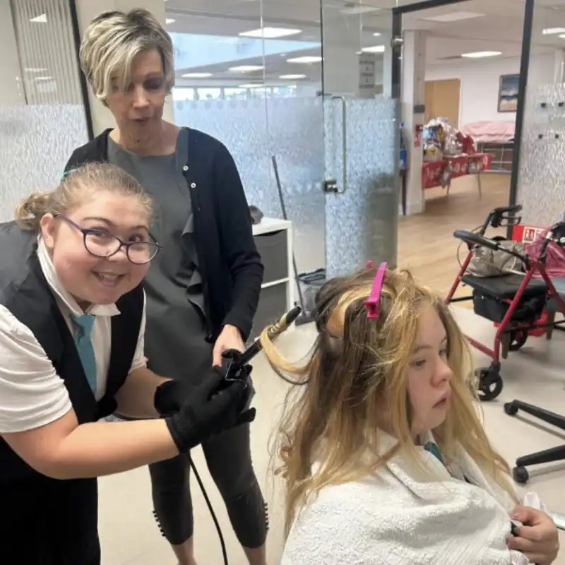 Student working in salon