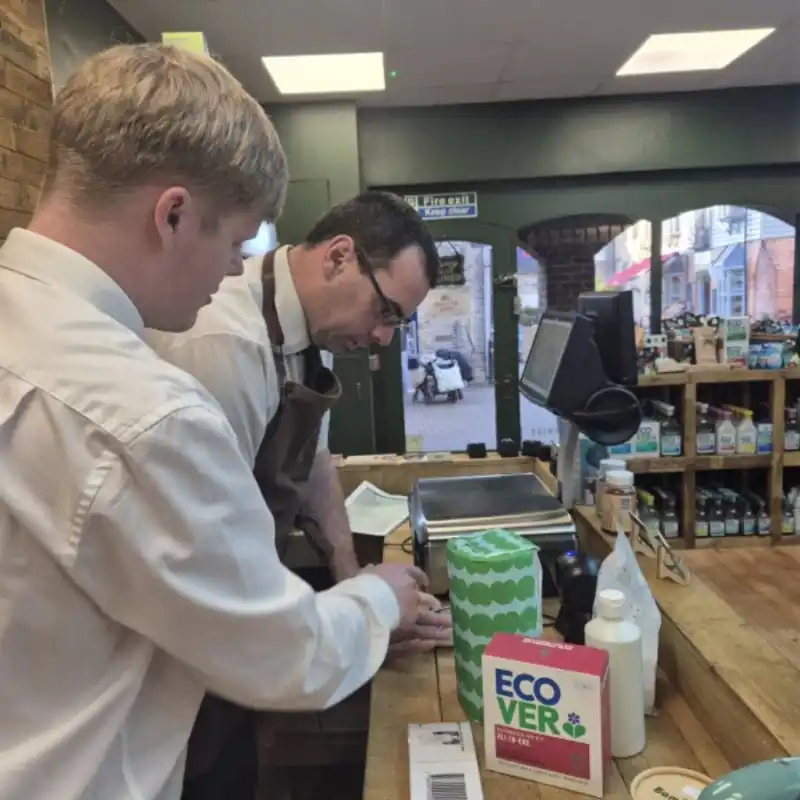 Staff member teaching a student in the ECO Shop